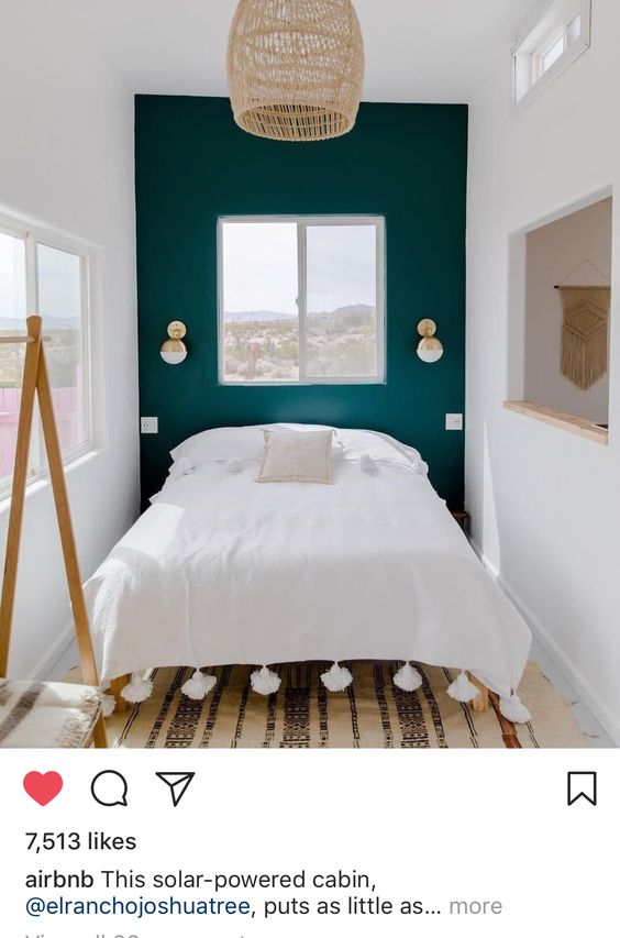 dark green accent wall in tiny bedroom
