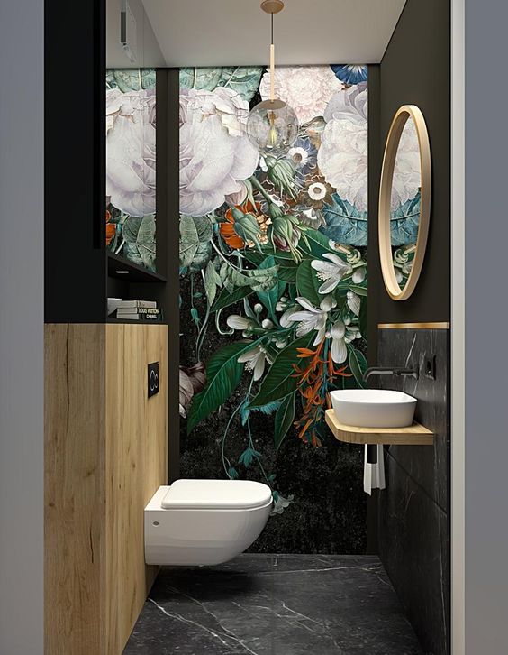 dark powder room with exotic moody wallpaper