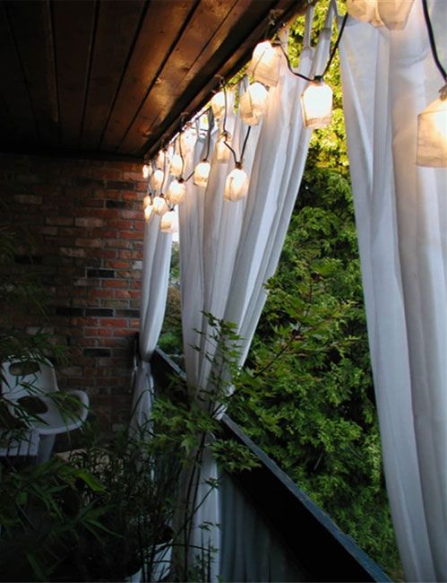drape curtains on small balcony for privacy